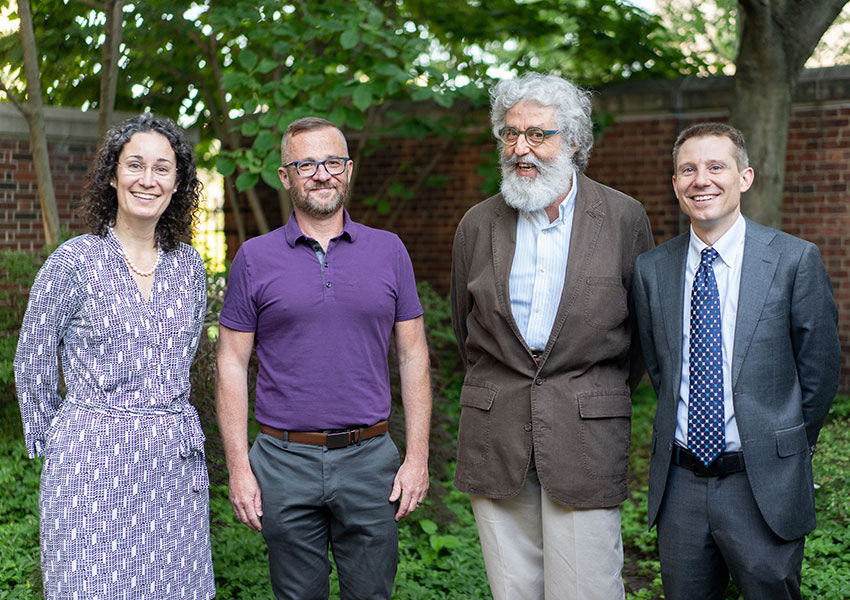 Dean Walker with three faculty members