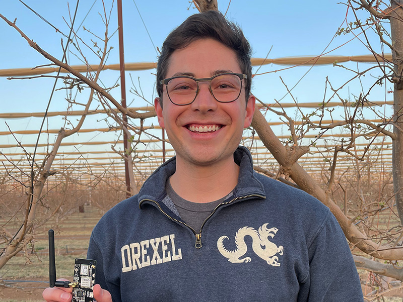 Engineering alumnus Dante Sawatzky in his apple orchard
