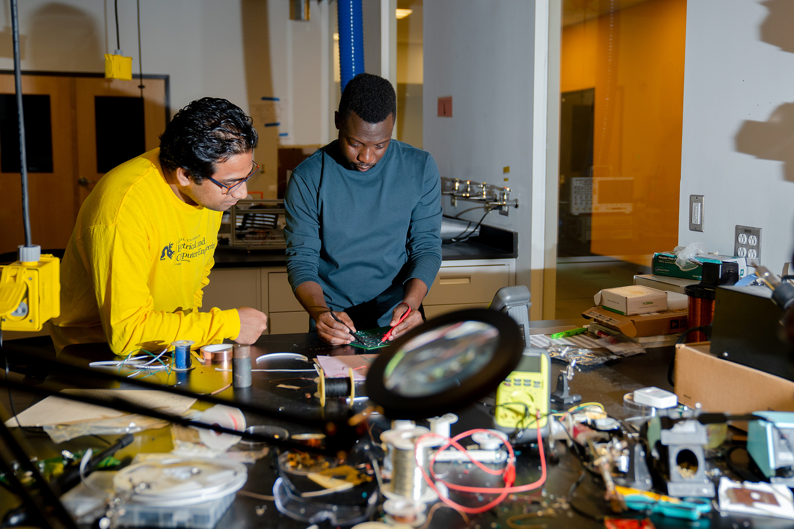 Students work on a circuit board