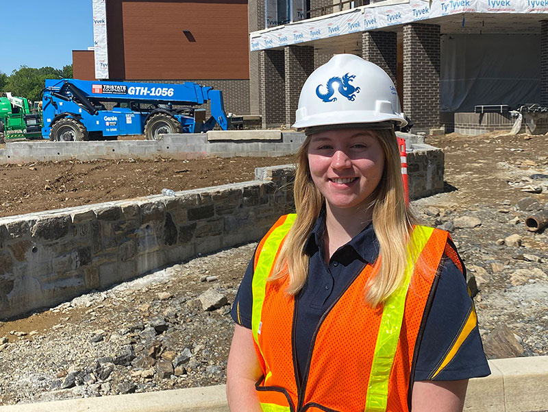 Woman in hard hat on construction site