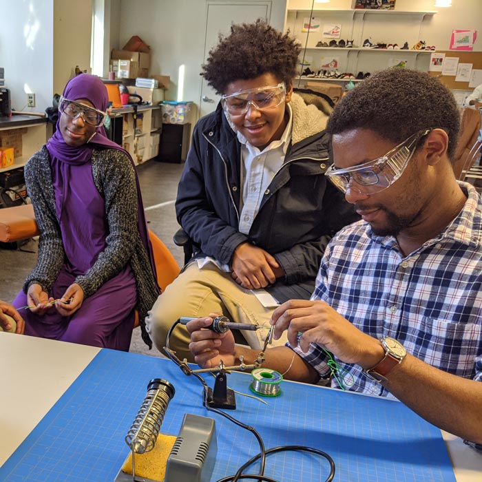 people smelting metal
