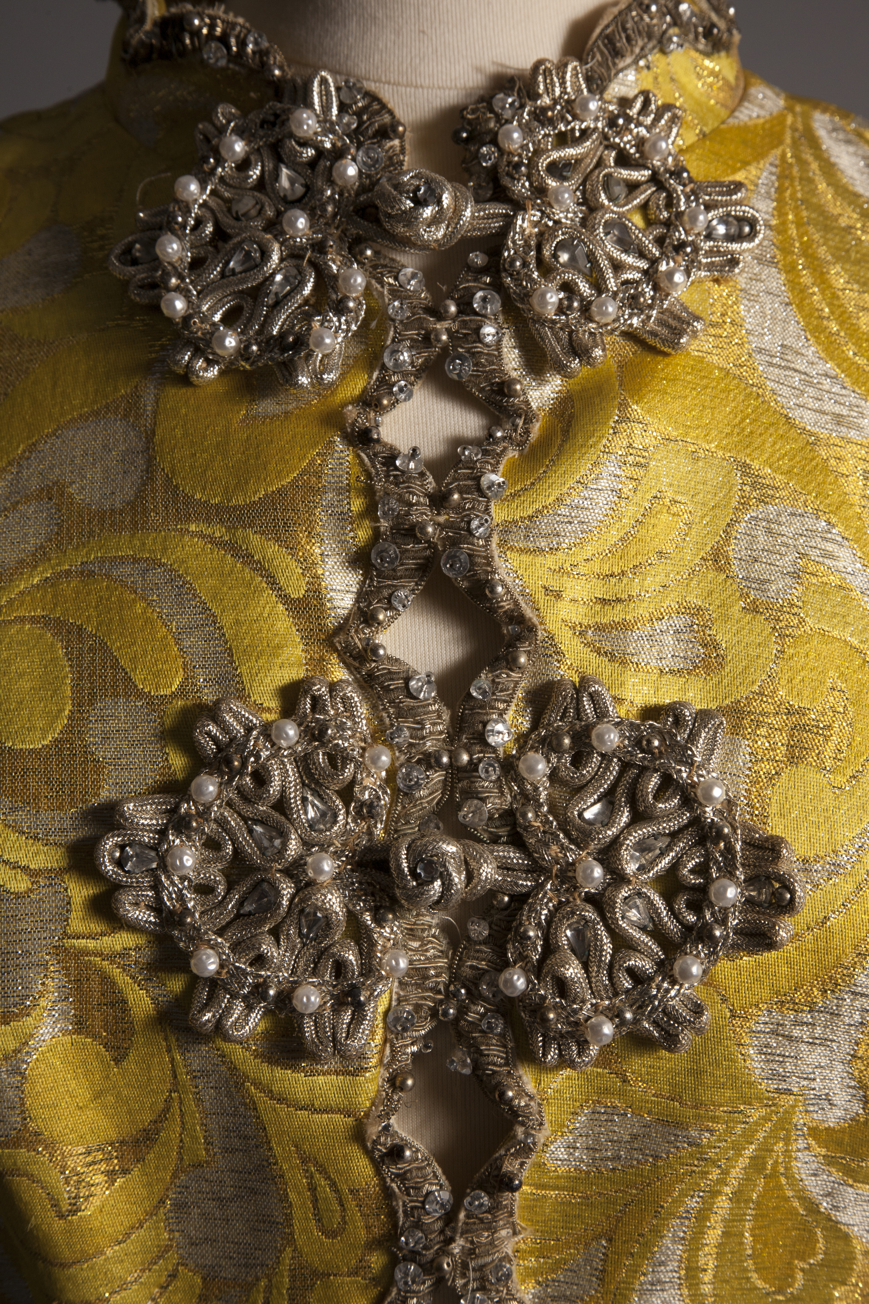 Detail shot of yellow dress with beading detail