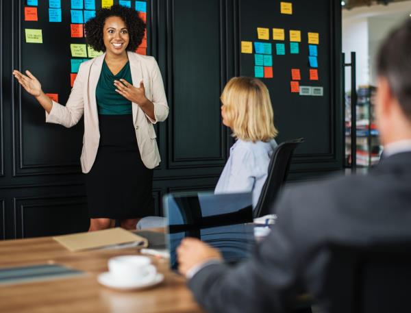 Woman presenting in on office