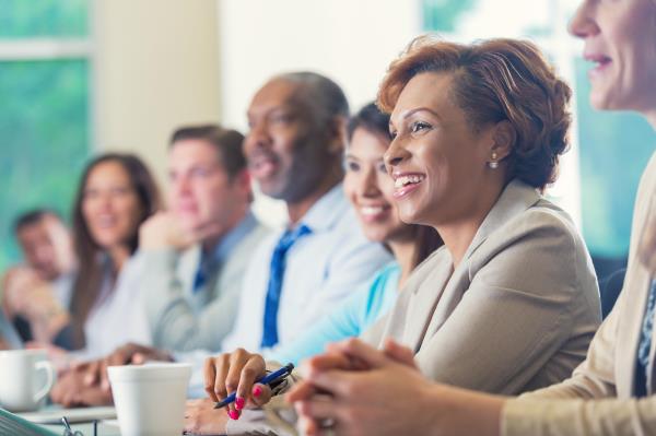 professional students smile while attending a lecture