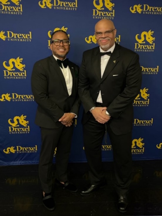 Brian Ellis and Lamont Wilson stop to pose for the camera during the gala