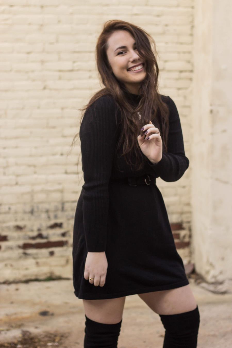 Nonprofit management student Alison Houghton smiling near a brick wall