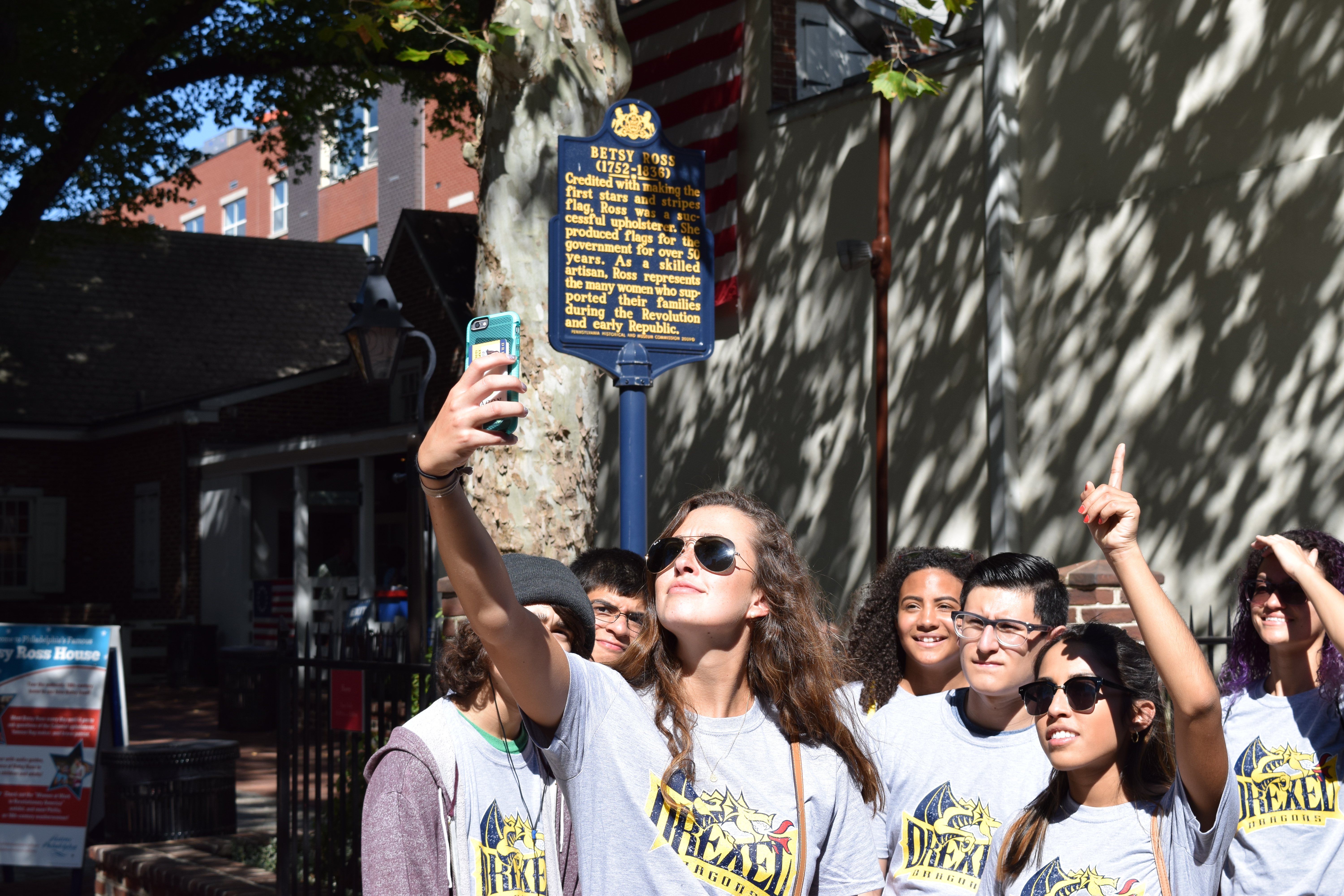 Students posing for selfie in front of Betsy Ross House