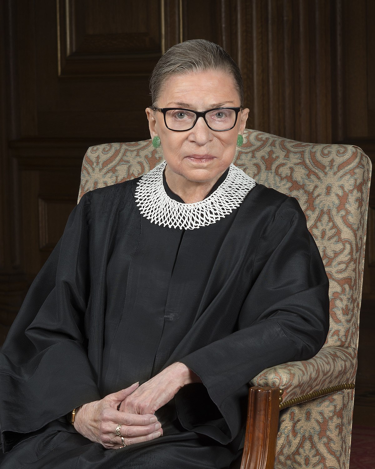 Image of Supreme Court Justice Ruth Bader Ginsburg, wearing her black robe and infamous white collar.