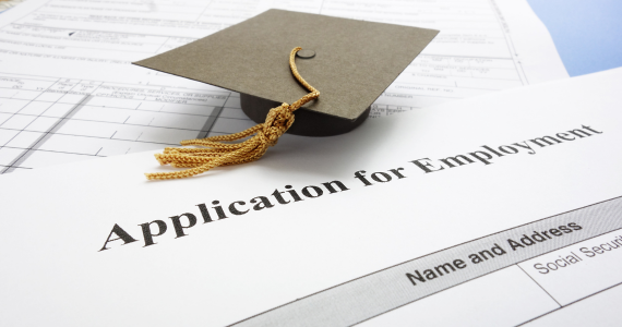 Photo of a Graduation Cap and a Resume