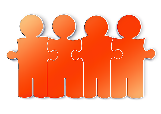 Image of people in the shape of puzzle pieces all locked together