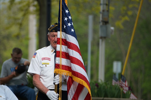 Veteran carrying an American Flag