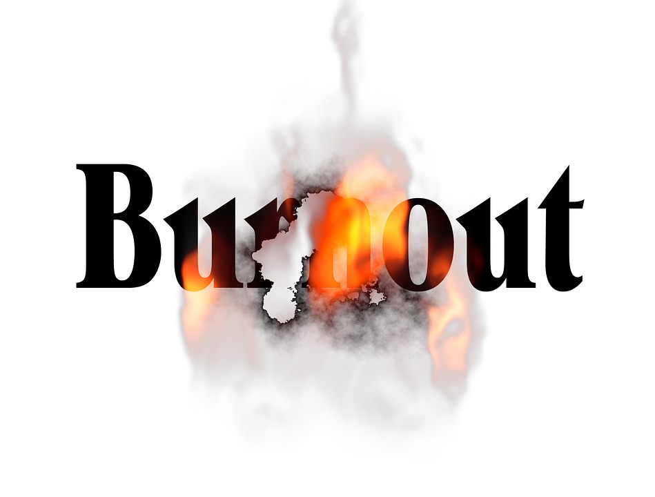 White background with the word "Burnout" in black bold font with a hole burning through it.
