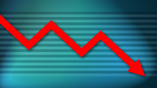 Chart depicting with a red line a downward trend on a blue background
