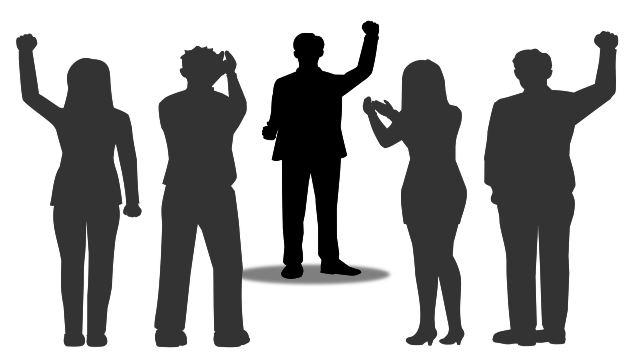 silhouette of a leader facing their team. The team members are clapping and raising their arms in agreement.