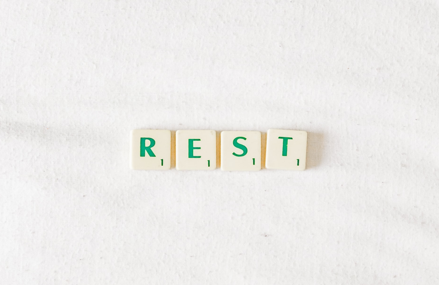 scrabble tiles that spell the word "rest"