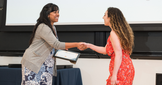 student shaking hand with mentor