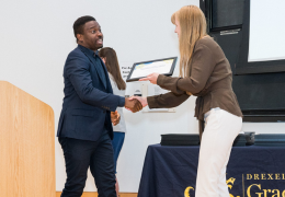 student receiving an award from an administrator