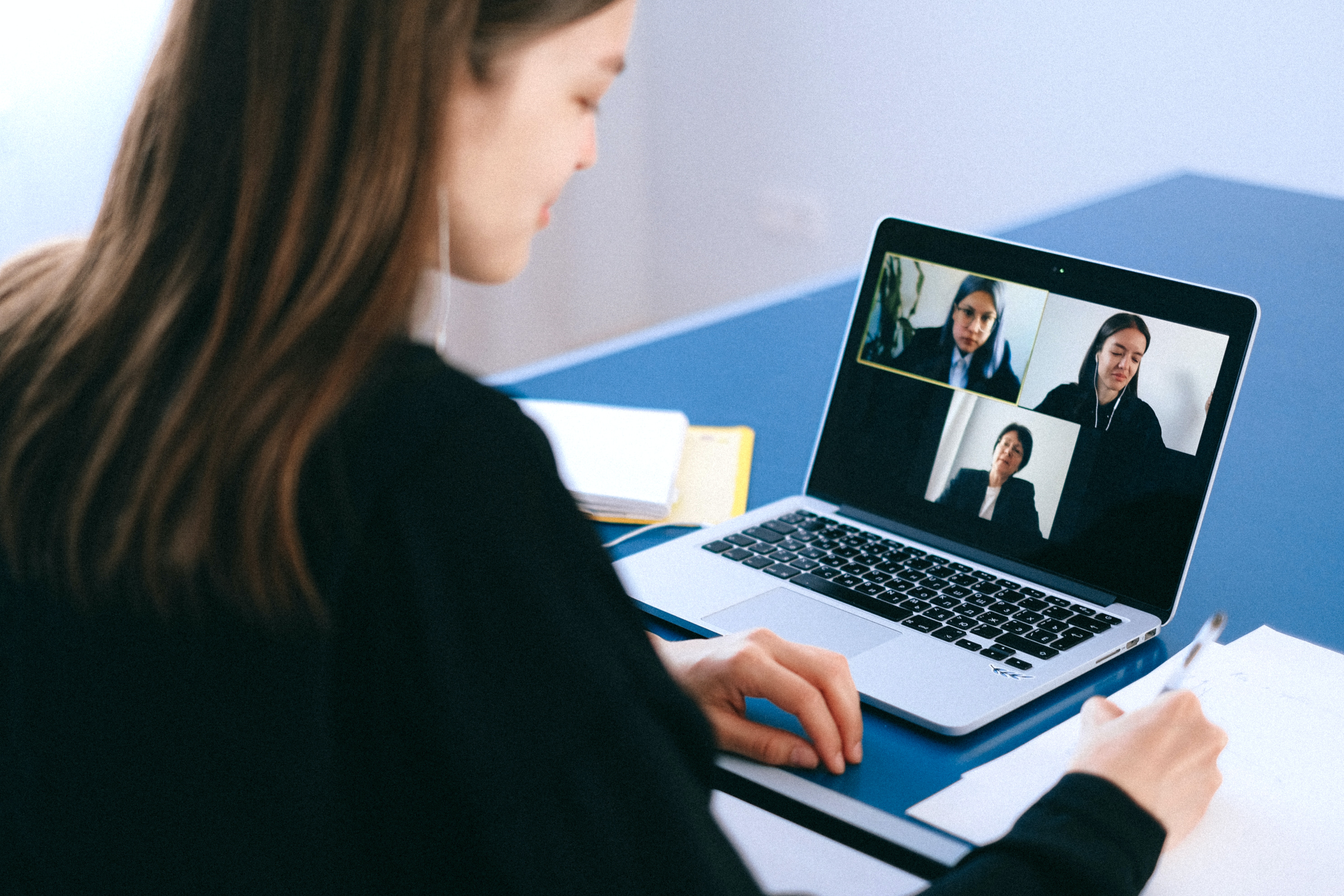 Woman partaking in a video conference on her laptop