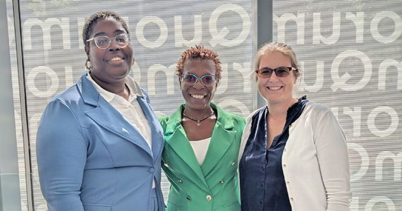 Three women smiling