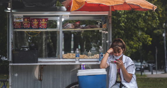 woman in Brazil selling food in the street
