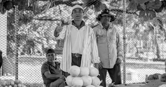 men in Latin America selling fruit