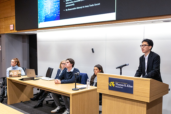 Clinic students give presentations to the startup community.