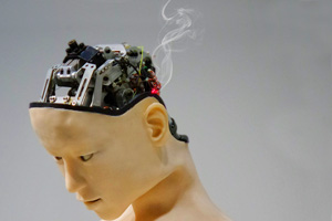 Smoke rises from the head of a humanoid robot which has internal hardware partially exposed.