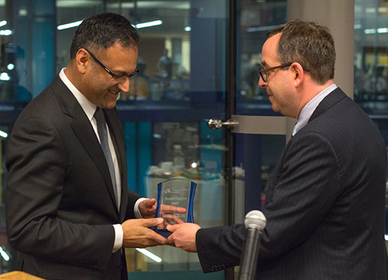 Nadeem Bezar accepts the Thomas R. Kline School of Law Diversity Champion Award from Dean Daniel Filler.