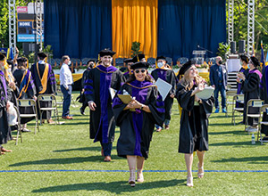Graduates who were in the stage party recess at the end of the ceremony for the Class of 2021.