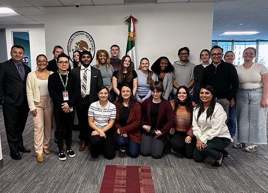 A group of student and faculty volunteers gather for a photo at the Mexican Consulate in Philadelphia.