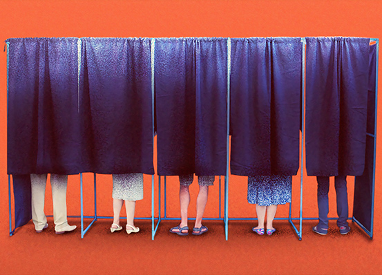 Five people using voting booths
