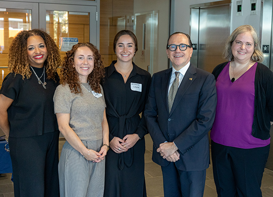 Weaving It All Together organizers pose with Drexel University President Merlo