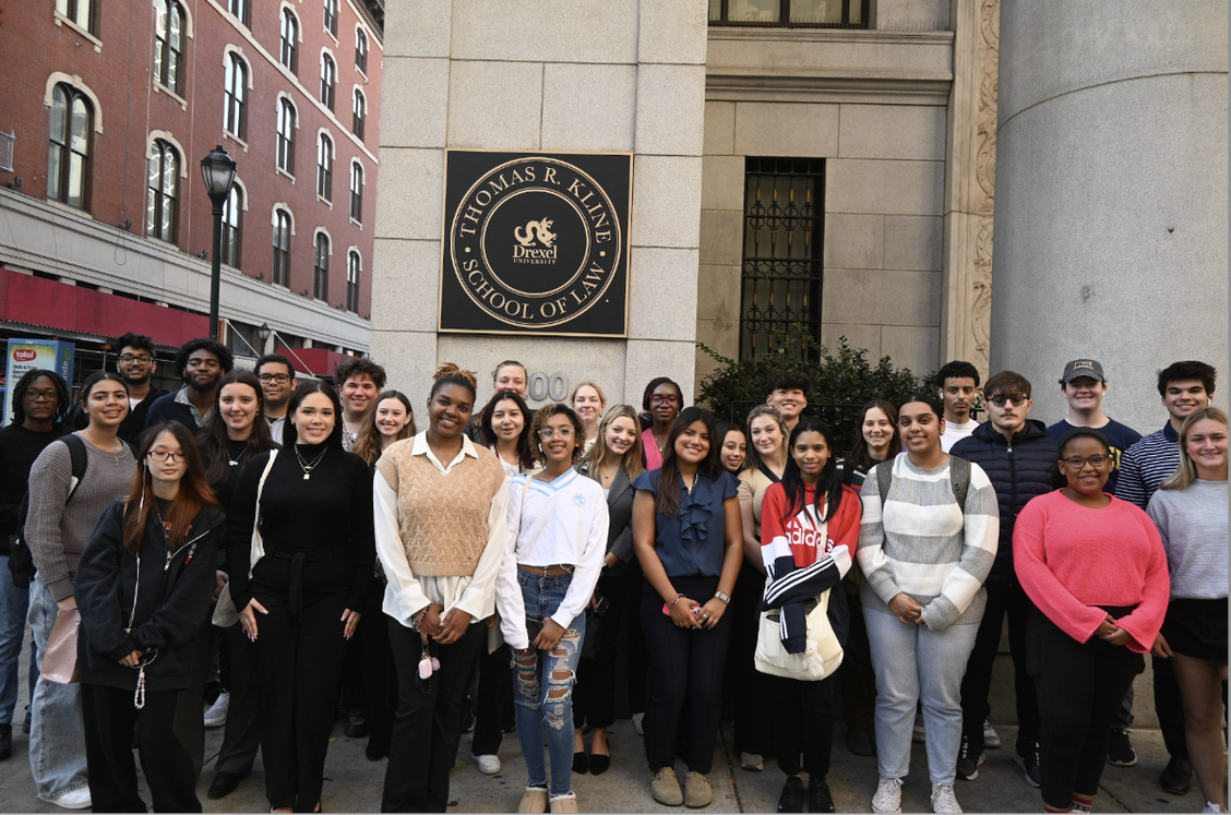 Undergraduate Law students stand in front of the Kline Institute of Trial Advocacy.