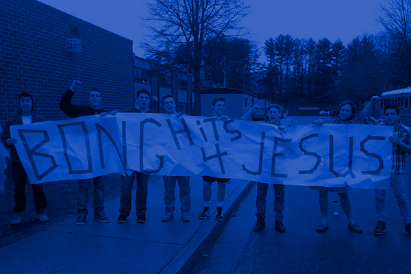 Students hold banner that says "Bong Hits 4 Jesus."