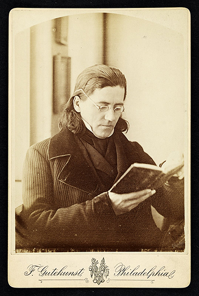 Portrait of Constantine Hering holding a book. (The Legacy Center Archives and Special Collections)