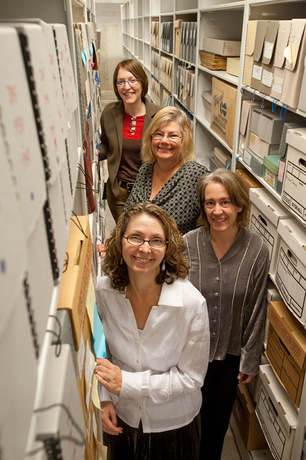 Archives staff in the stacks. (The Legacy Center Archives and Special Collections)