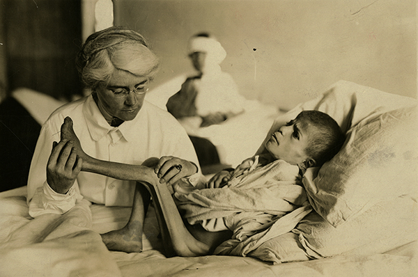  Dr. Mabel Elliot with child patient, 1920. (The Legacy Center Archives and Special Collections)