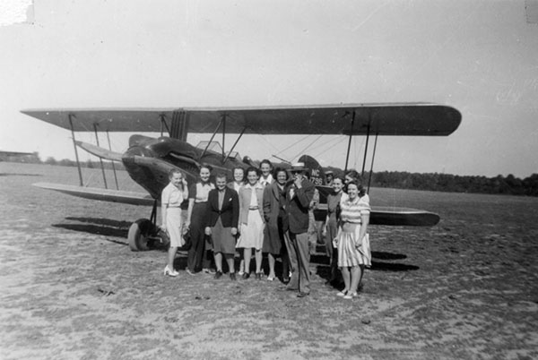 Members of the class of 1944 of Woman's Medical College of Pennsylvania pose with Dr. Kuhlenbeck at Somerton Airport (The Legacy Center Archives and Special Collections)