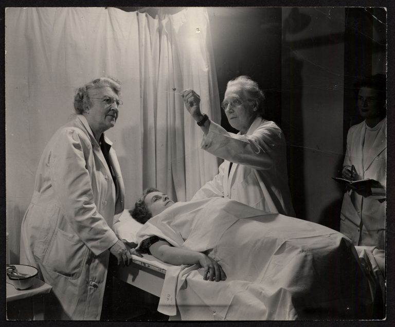 Doctors Macfarlane and Sturgis at the cancer clinic (The Legacy Center Archives and Special Collections)