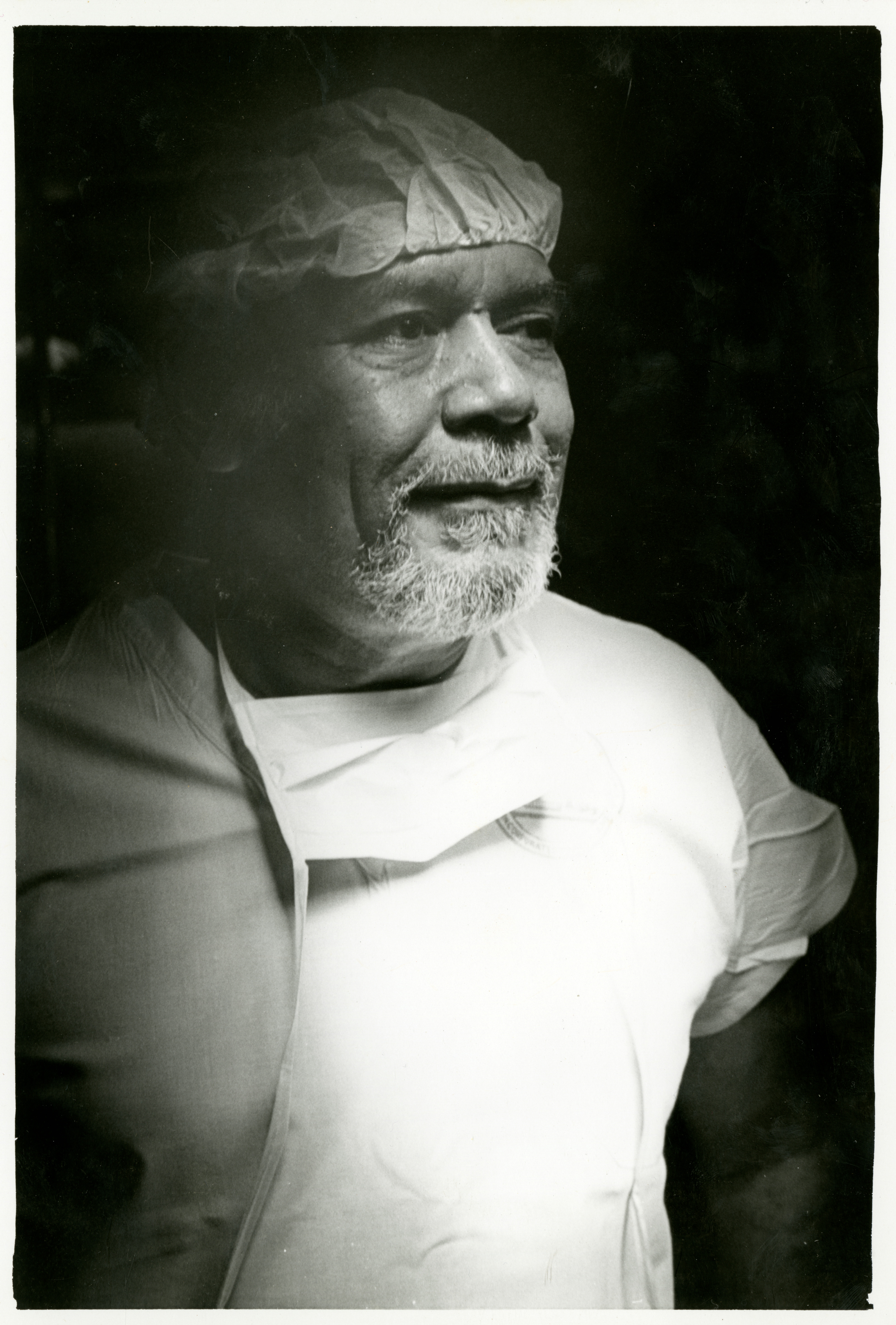 Black-and-white photograph of Dr. Maurice Clifford wearing surgical scrubs, in right profile, undated. (The Legacy Center Archives and Special Collections)