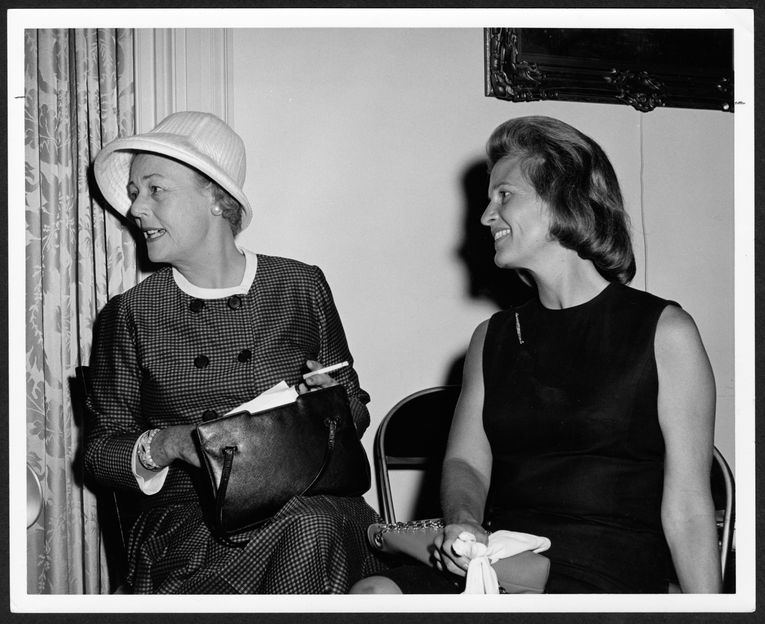 Black and white photograph of 2 women committee members for a benefit of the film 'The Happiest Millionnaire' (The Legacy Center Archives and Special Collections, p7438)