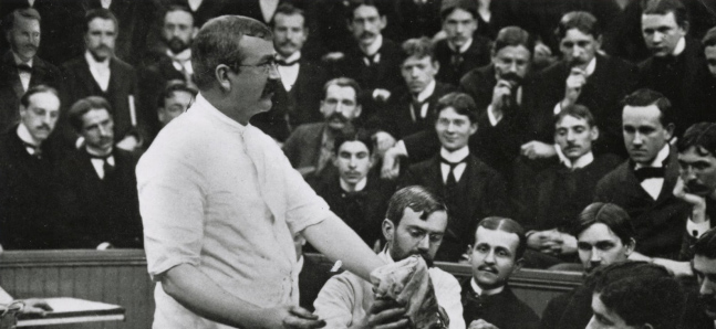 Dean van Lennep during a surgical lecture in an amphitheater. (The Legacy Center Archives and Special Collections)