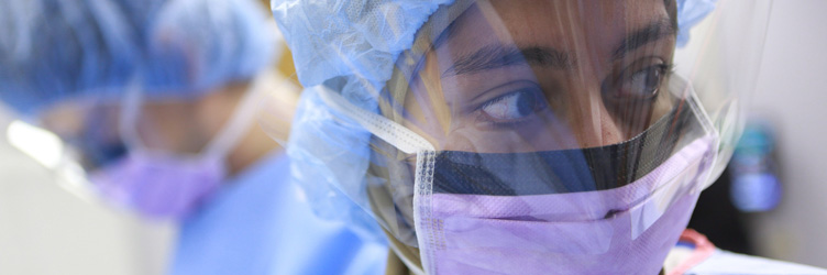 A graduate student in the Infectious Disease program at Drexel University College of Medicine working in the laboratory.