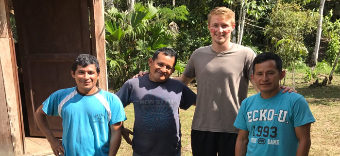 Drexel med student Garrett Mayo with the guides of the Amazonian community.