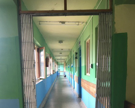 Drexel medical student Matthew Recker in Paro, Bhutan with Surgicorps - Facility Hallway.