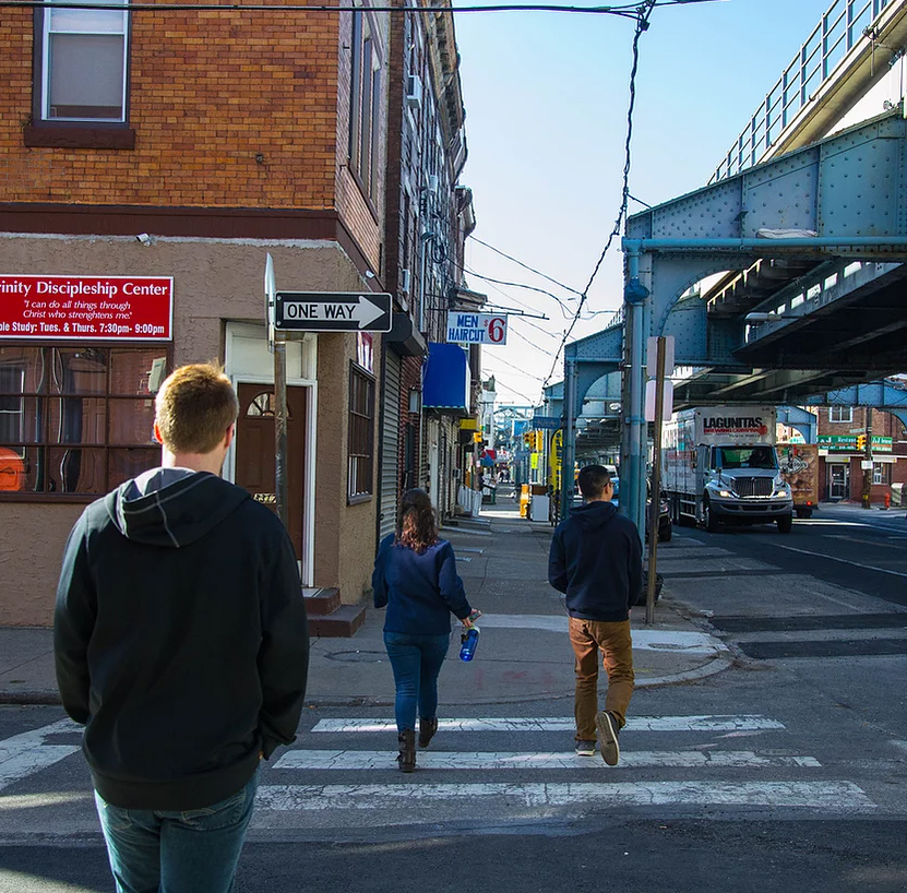 Health Outreach Project students walking down a street in Philadelphia.