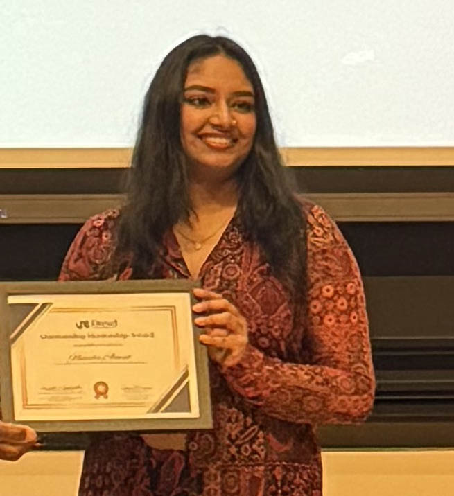 woman holding award