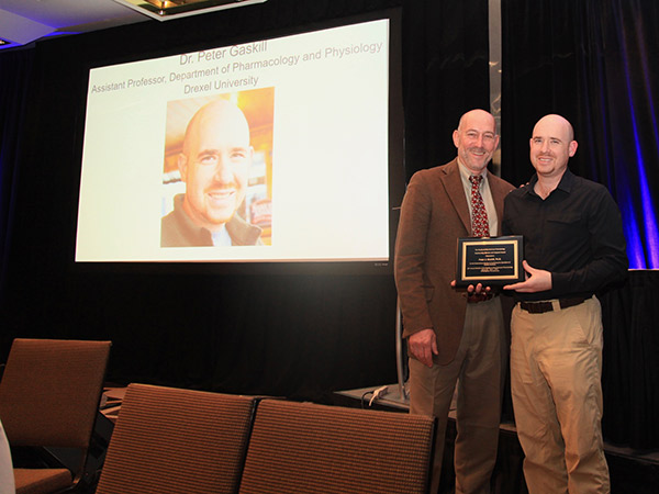Peter Gaskill receiving his Outstanding Service and Support Award from the Society of Neuroimmune Pharmacology (SNIP)