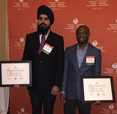 Drs. Harpreet Singh and Patrick Osei-Owusu with their certificates