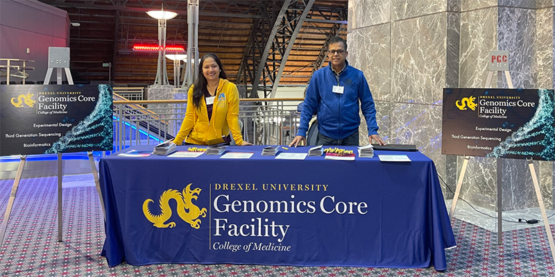 Drs. Bhawati Sen, Genomics Core Facility (GCF) lab manager (left) and Azad Ahmed, GCF assistant director (right), manning the GCF booth at Drexel University's 2022 Discovery Day, Philadelphia Convention Center.